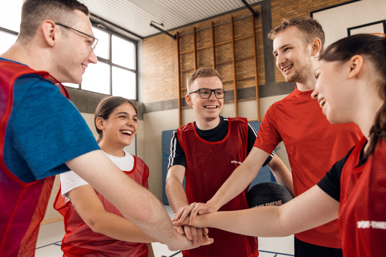 Trainees standing in a circle during trainee sports.